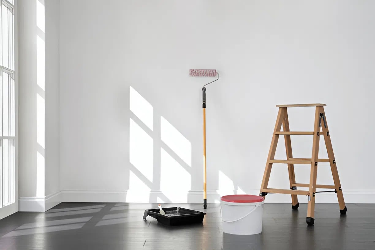 Painting setup with roller and fresh white walls prepared by an interior painter in Ashland, VA