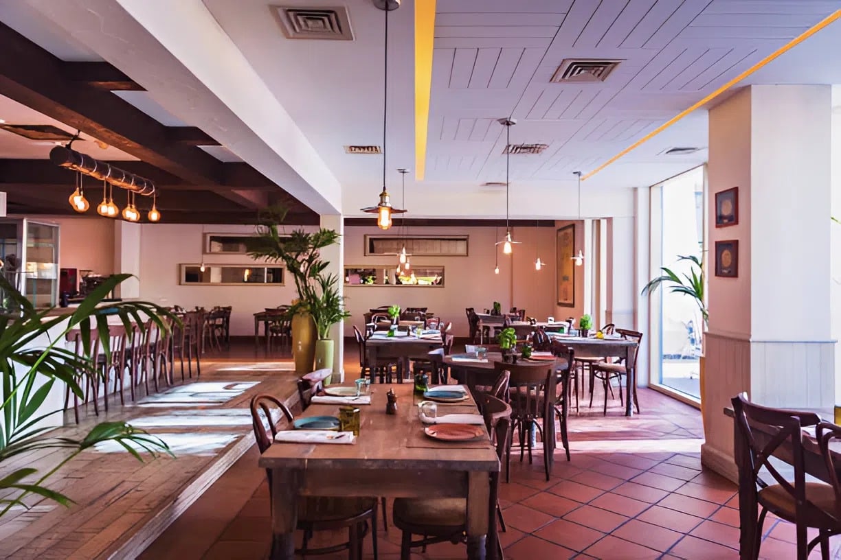 Bright restaurant interior with warm neutral walls and wood accents by a commercial painter in Chesterfield, VA